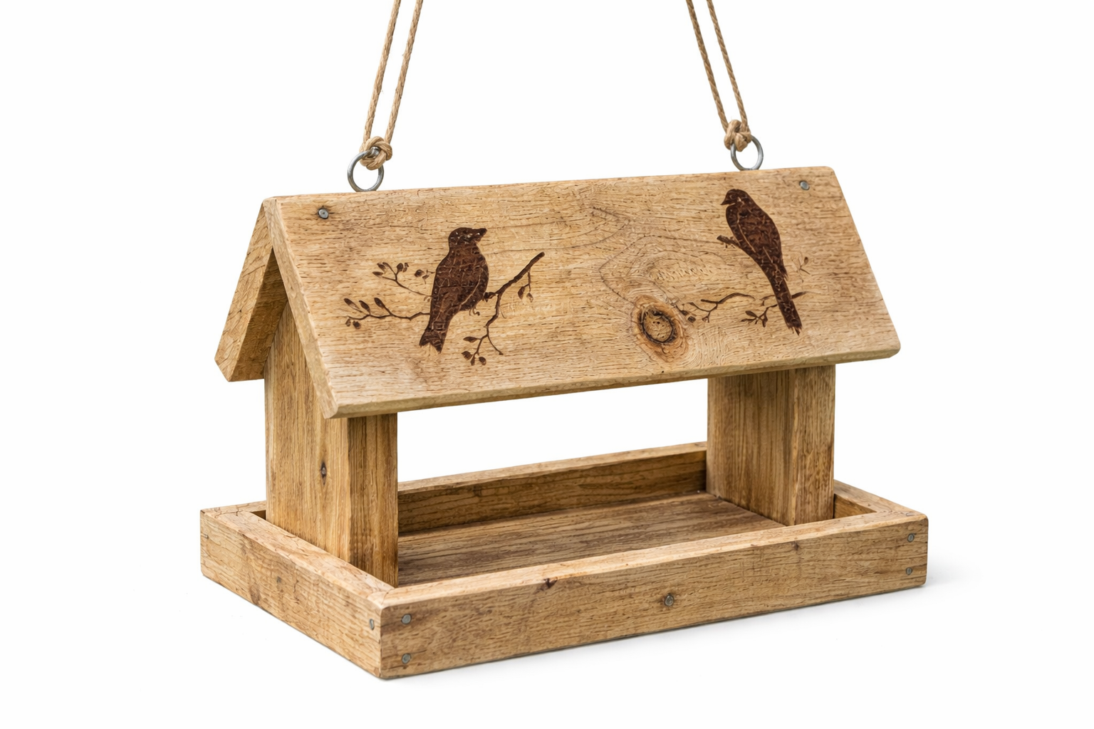 Upcycled wooden bird feeder with pyrography bird design on white background