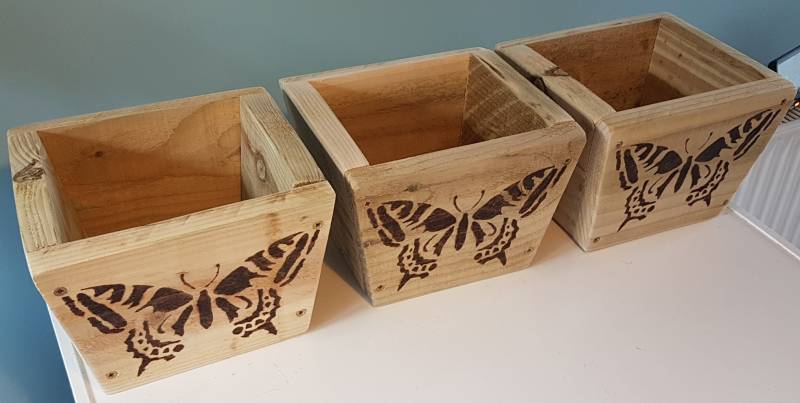 upcycled garden pots set with butterflies