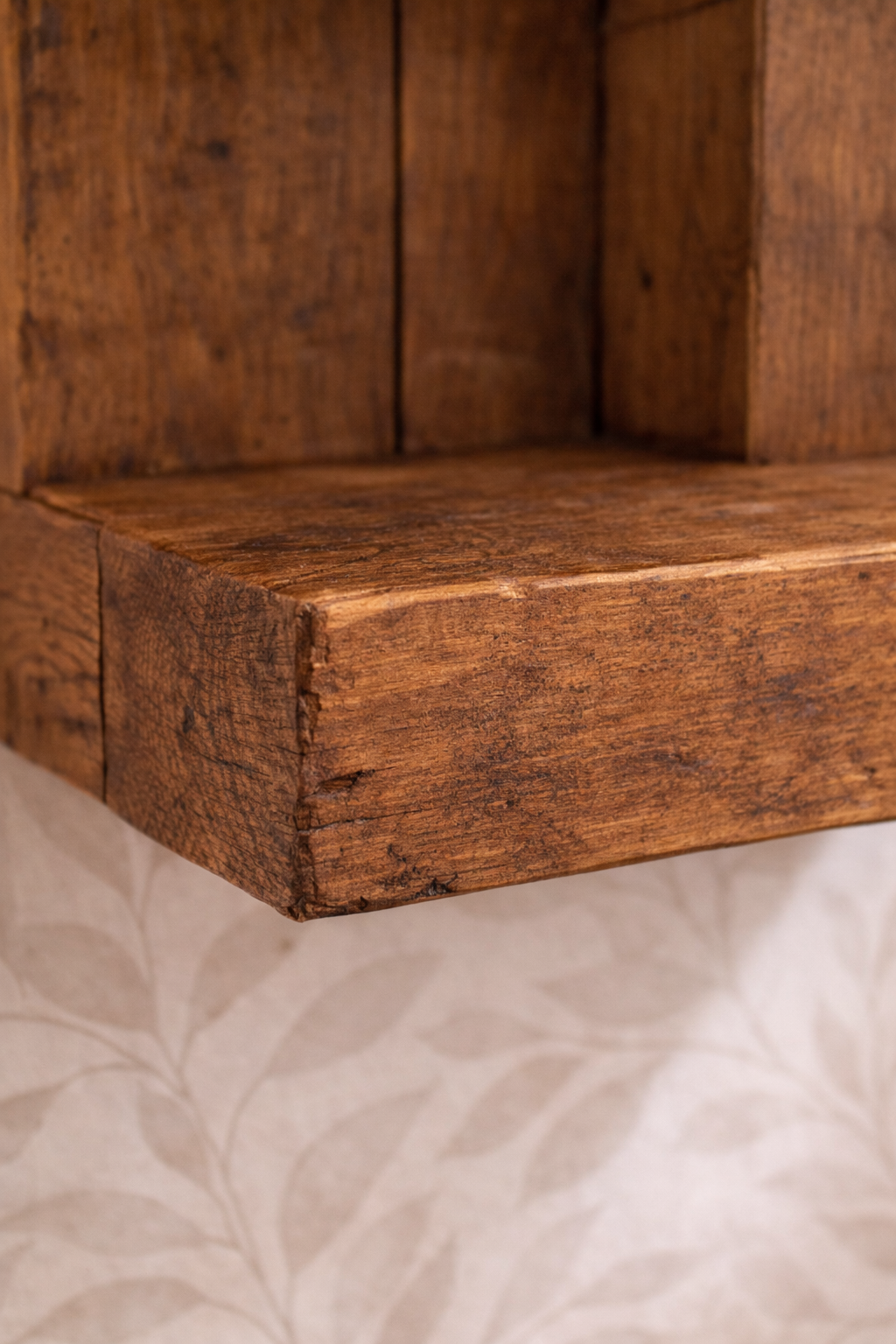 Close up of antique pine reclaimed scaffold board showing thick shelf and wood grain