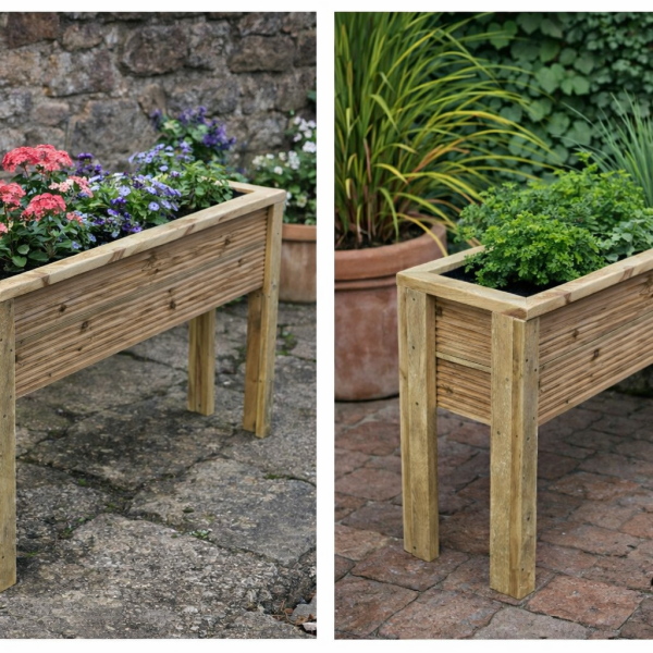 Raised wooden decking planter in garden setting with herbs and flowers planted inside